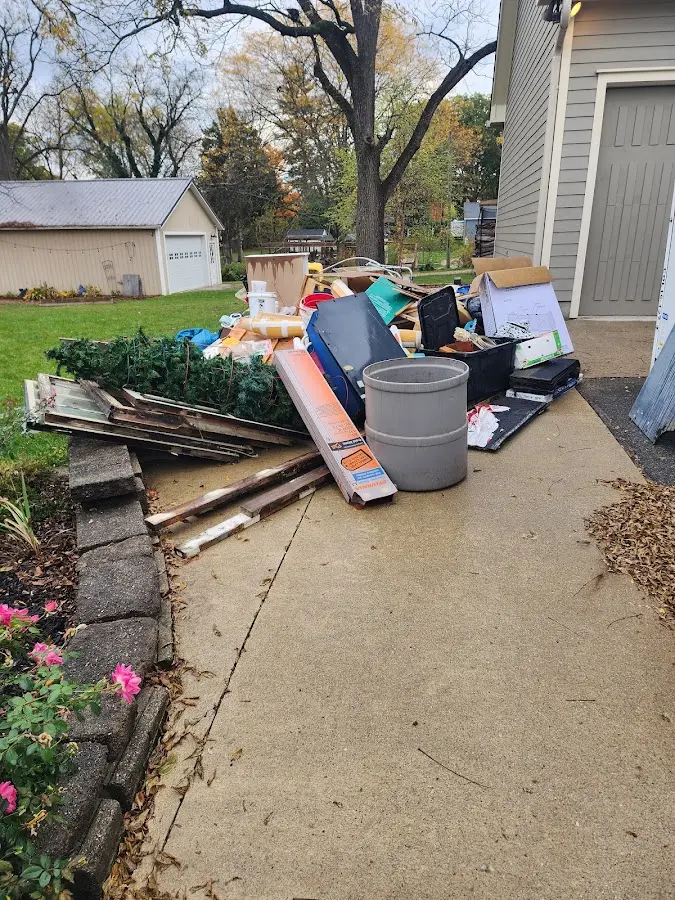Dumpster being loaded with debris for Roofing Dumpster Rental in Mountain Home
